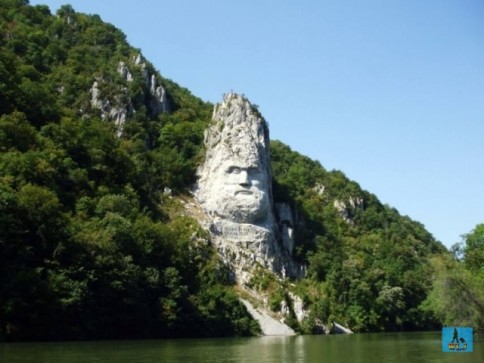 Decebal's face sculpted into rock can be seen from a cruise on the Danube River, Mehedinti County